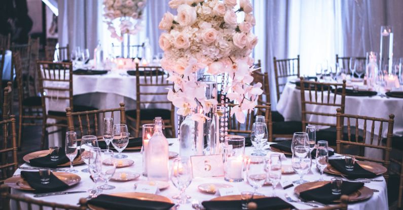 Dining Tables - Pink and White Roses Centerpiece on Top of Table