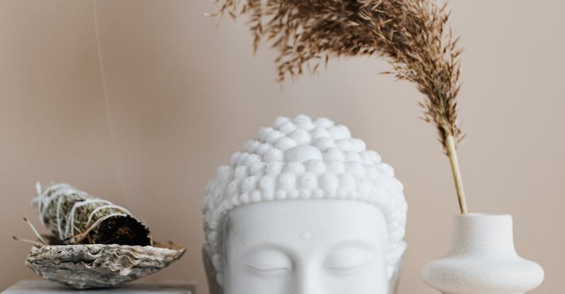 Authentic Décor - Vase with dried herb arranged with Buddha bust and sage smudge stick in bowl